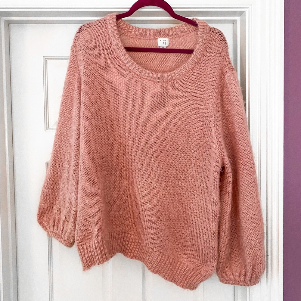 light pinkish fuzzy sweater